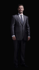 Handsome mature business man isolated on black background