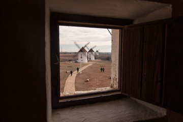 windmills through the window in La Mancha, Spain