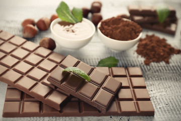 Tasty chocolate on wooden table