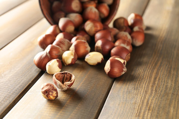 Scattered hazelnuts on wooden table