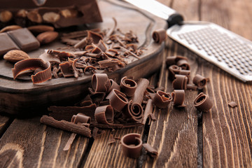 Chocolate curls on wooden table