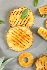 Grilled pineapple slices on table
