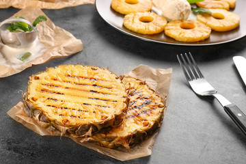 Grilled pineapple slices on table