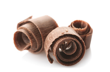 Delicious chocolate curls on white background