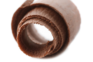 Delicious chocolate curl on white background, closeup