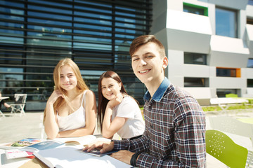 Portrait of three happy high school students