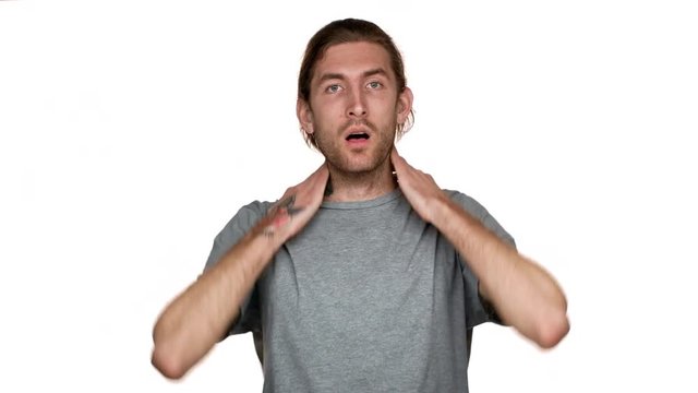 Portrait of tall guy in panic grabbing head and expressing stress or disbelief about tense situation, isolated over white background. Concept of emotions