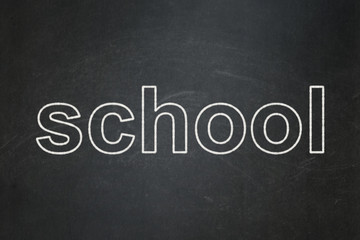 Obraz premium Learning concept: text School on Black chalkboard background