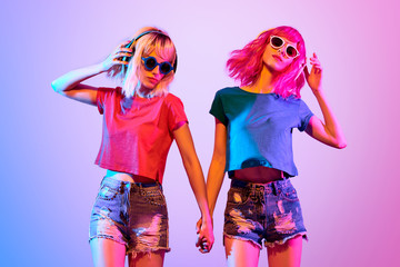 Two DJ Girl Hipster with Fashion Hairstyle Dance.