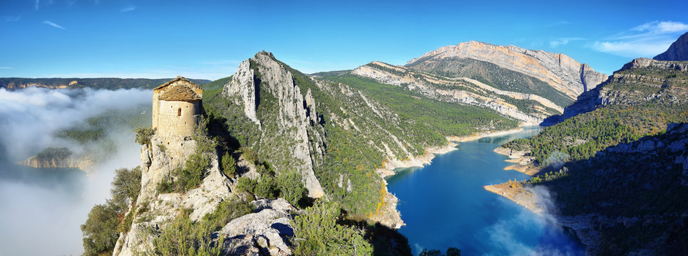 Romanesque Chapel of Mare de Deu de la Pertusa over the Canelles reservoir in Lleida, Catalonia, Spain.