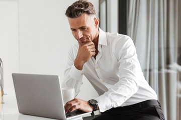 Confident man dressed in formal clothes