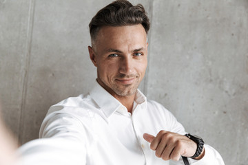 Portrait of a confident man in white shirt