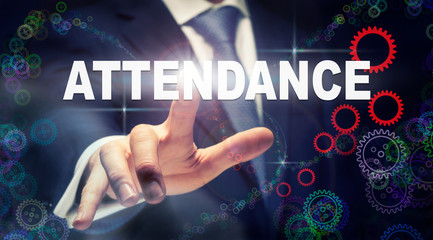 A businessman pressing a Attendance business concept on a graphical display of cogs