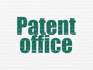 Law concept: Painted green text Patent Office on White Brick wall background