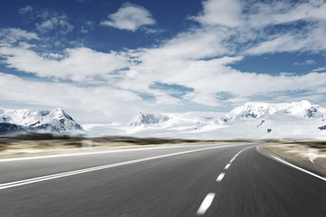 empty asphalt road with snow mountain
