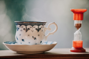 Elegant tea cup and hourglass stand shelf