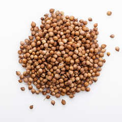 fragrant coriander seeds on a white background