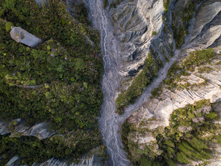 Top Down Aerial Of Putangirua Pinnacles River Hike In New Zealand 