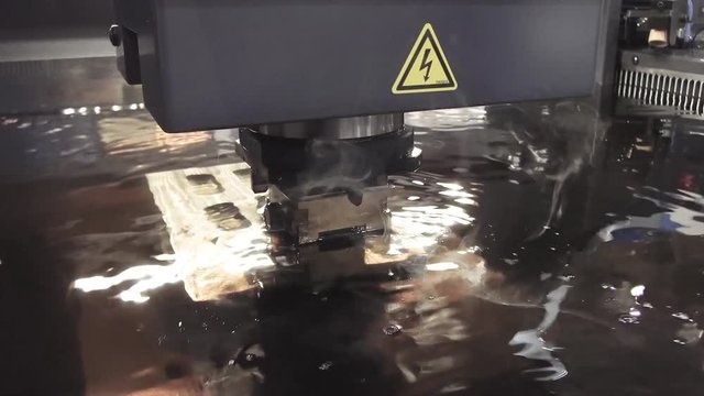 Electroerosive CNC EDM machine in the process.
