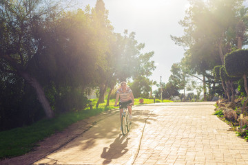 Young fit man during a bike ride on a sunny day.