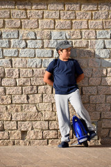 A young boy riding a mono wheel in the natural park of Mount Ifach on the Mediterranean coast in Calpe Spain