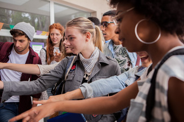 Students checking information board on campus