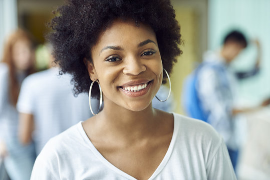 Female college student smiling cheerfully, portrait - Powered by Adobe