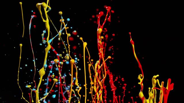 Colorful splashing paint in super slow motion. Shot with high speed cinema camera, 1000fps