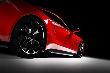 Modern red sports car in a spotlight on a black background. - obrazy, fototapety, plakaty