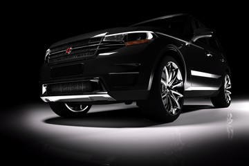 Front view of modern black SUV car in a spotlight