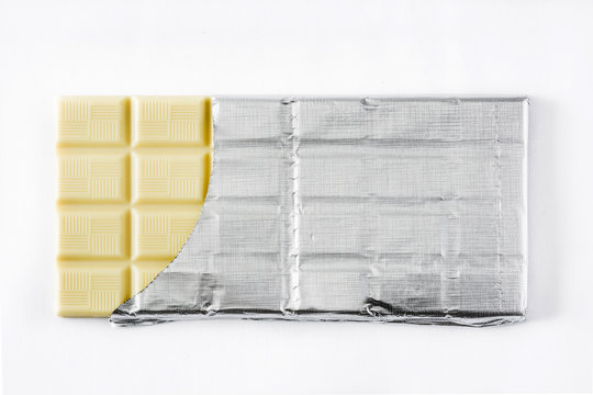 White chocolate bar isolated on white background. Top view