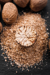 aromatic nutmeg on a dark stone background