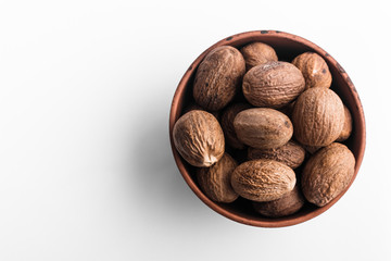 aromatic nutmeg on a white acrylic background