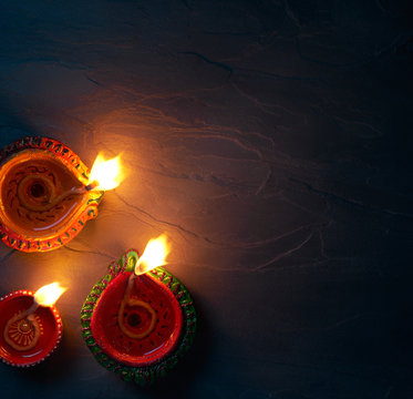 Diya lamps lit during diwali celebration, top view