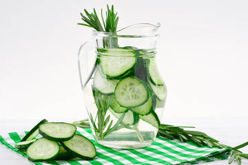 Cucumber and Rosemary Infused Water on wooden table