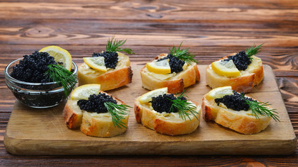 Toastes with black caviar. Spase for text or design.