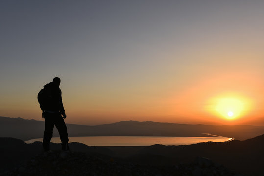 adventurous mountaineer following Sunrise