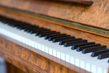 The old wooden piano keyboard musical instrument to play at home, restaurant or concert concept