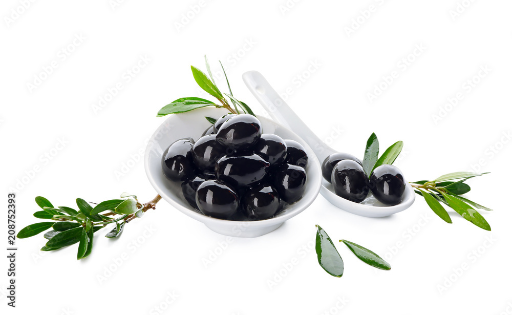 Wall mural bowl and spoon with black olives on white background