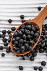 dried juniper berries on a white background