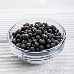 dried juniper berries on a white background