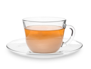 Glass cup of aromatic tea with milk on white background