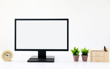 Workspace with screen computer, flower plant at home or studio. Mock up desk space.