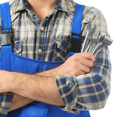 Car mechanic with tools on white background, closeup