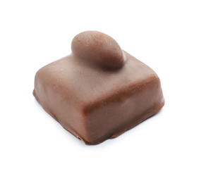 Tasty chocolate candy with nut on white background