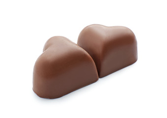 Obraz na płótnie Canvas Tasty heart-shaped chocolate candies on white background