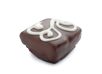 Tasty dark chocolate candy on white background