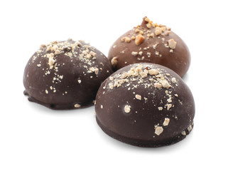 Tasty chocolate candies on white background
