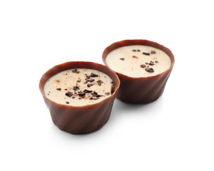 Tasty chocolate candies on white background