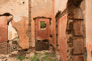 Old red brick/ stone walls of abandoned houses, background/ texture.